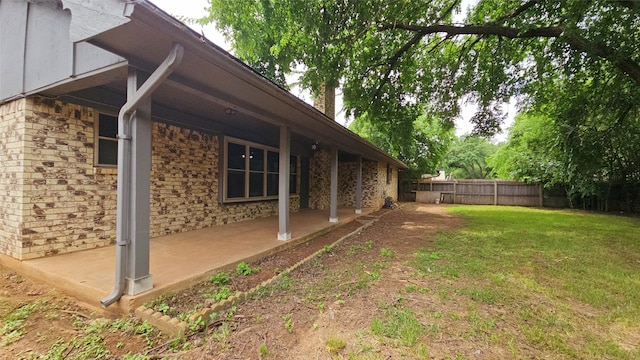 view of yard featuring a patio and fence