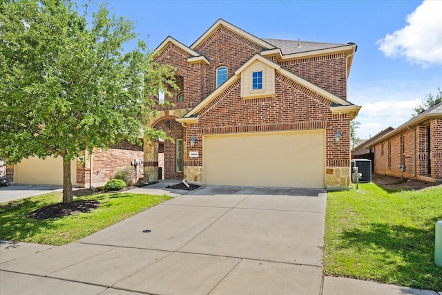9933 Cottontail Ln, Mckinney, TX 75071 - traditional-style house with brick siding, driveway, a front yard, cooling unit, and stone siding