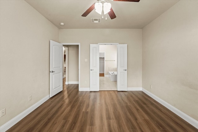 9933 Cottontail Ln, Mckinney, TX 75071 - unfurnished bedroom featuring wood finished floors, baseboards, ensuite bathroom, and a ceiling fan