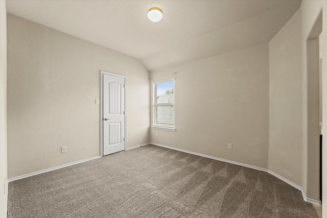 9933 Cottontail Ln, Mckinney, TX 75071 - empty room with carpet floors, lofted ceiling, and baseboards