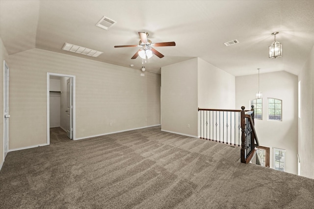 9933 Cottontail Ln, Mckinney, TX 75071 - spare room featuring carpet flooring, healthy amount of natural light, ceiling fan, lofted ceiling, and baseboards