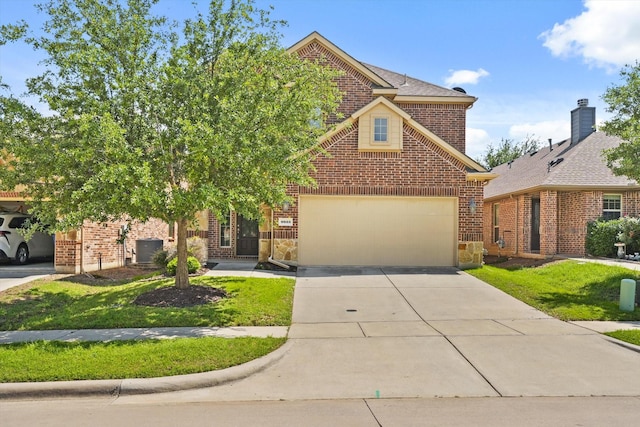 9933 Cottontail Ln, Mckinney, TX 75071 - view of front of home with brick siding, concrete driveway, a front yard, and cooling unit