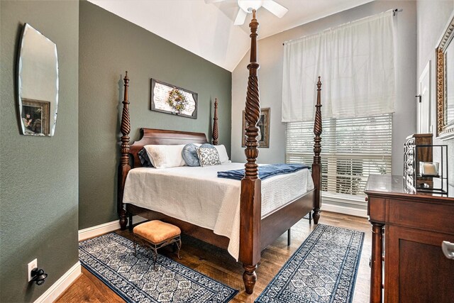 bedroom with baseboards, ceiling fan, and wood finished floors