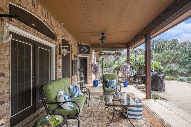 view of patio / terrace with a ceiling fan, an outdoor hangout area, and area for grilling