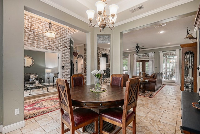 dining room featuring crown molding, stone tile floors, visible vents, and ceiling fan with notable chandelier