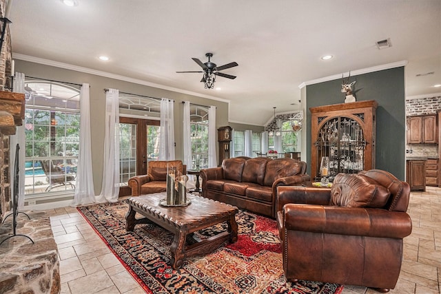 living room featuring crown molding, a ceiling fan, recessed lighting, and stone tile flooring