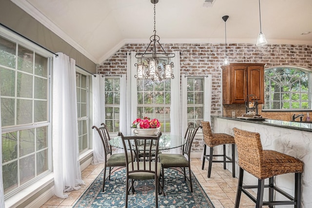 sunroom featuring visible vents and a notable chandelier