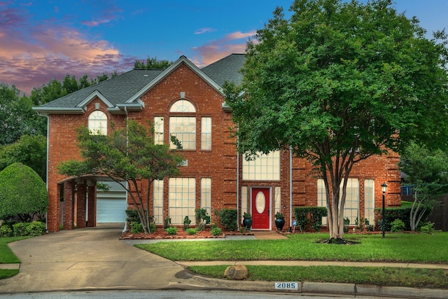2085 Idlewood Dr, Grapevine, TX 76051 - view of front facade featuring driveway, brick siding, a front lawn, a garage, and a shingled roof