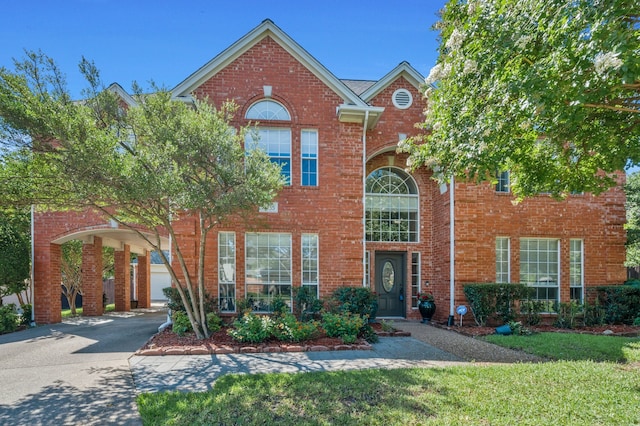 2085 Idlewood Dr, Grapevine, TX 76051 - view of front facade featuring brick siding and a front yard