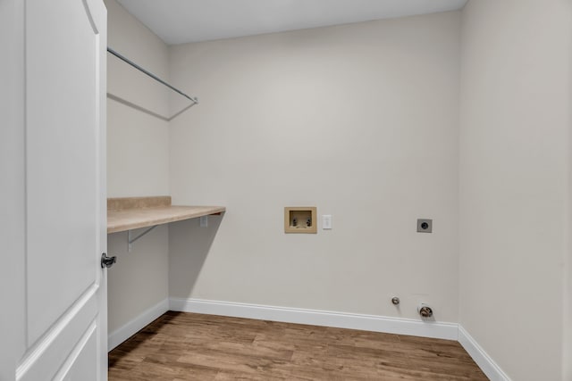 2085 Idlewood Dr, Grapevine, TX 76051 - laundry room with hookup for an electric dryer, hookup for a washing machine, wood finished floors, and hookup for a gas dryer