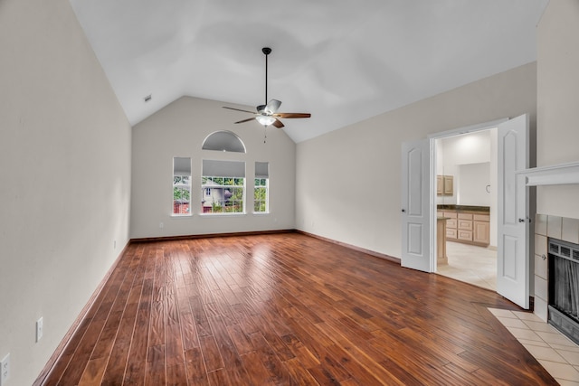 2085 Idlewood Dr, Grapevine, TX 76051 - unfurnished living room with a fireplace, ceiling fan, light wood-style flooring, and lofted ceiling