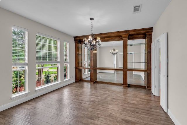 2085 Idlewood Dr, Grapevine, TX 76051 - unfurnished dining area featuring a chandelier and wood finished floors