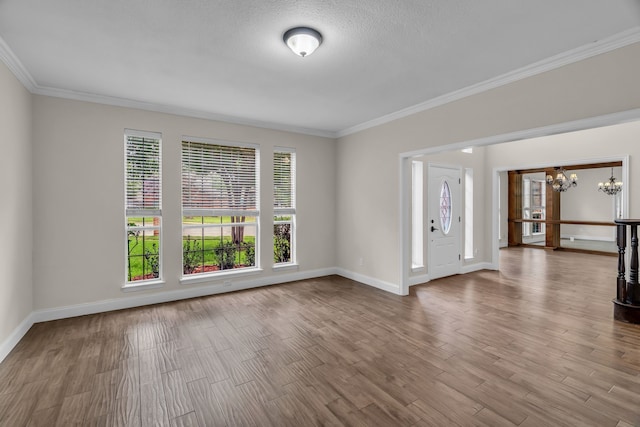 2085 Idlewood Dr, Grapevine, TX 76051 - empty room with a chandelier, ornamental molding, and wood finished floors