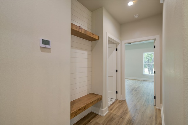 mudroom with recessed lighting, baseboards, and light wood-type flooring