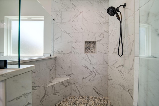 full bathroom featuring a tile shower