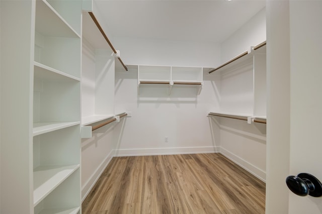 spacious closet with wood finished floors