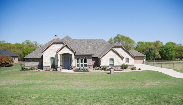 124 Big Oak Ln, Weatherford, TX 76085 - rear view of house featuring fence, a chimney, a yard, and stone siding