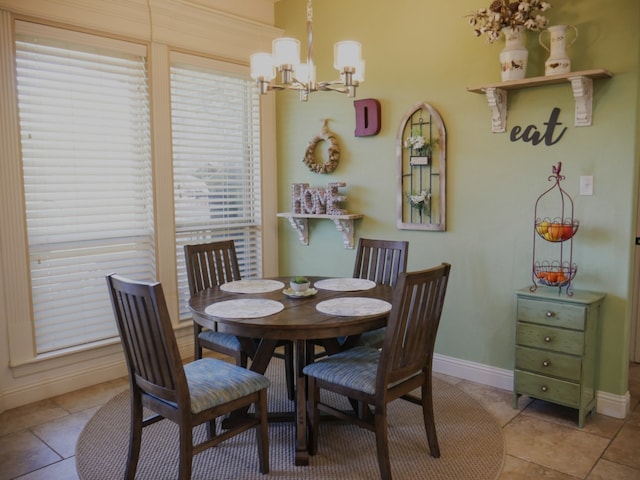 124 Big Oak Ln, Weatherford, TX 76085 - dining area with baseboards, a chandelier, and light tile patterned floors