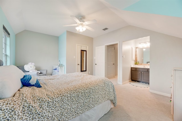 1355 Crockett Dr, Frisco, TX 75033 - bedroom with vaulted ceiling, light colored carpet, baseboards, ceiling fan, and ensuite bath