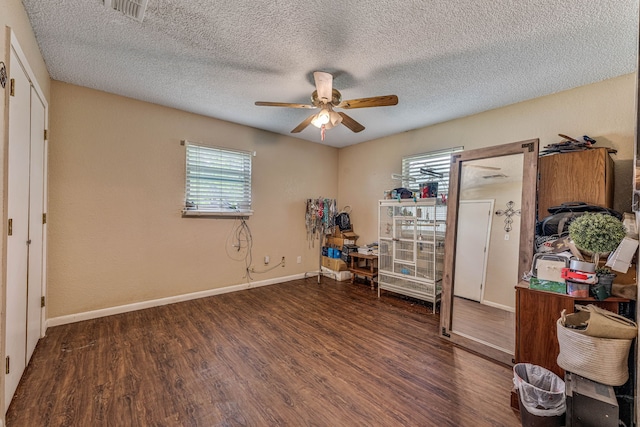 372 County Road 477, Stephenville, TX 76401 - interior space with visible vents, wood finished floors, baseboards, ceiling fan, and a textured ceiling