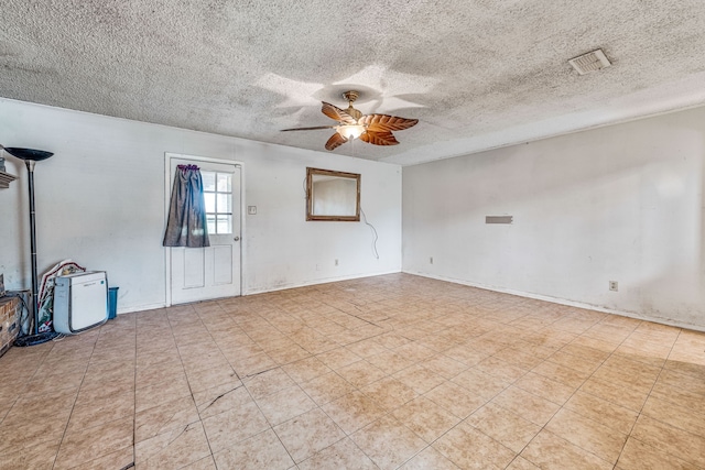 372 County Road 477, Stephenville, TX 76401 - empty room featuring visible vents, a ceiling fan, and a textured ceiling