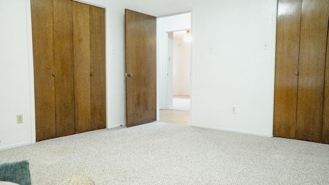 unfurnished bedroom featuring a closet and carpet flooring