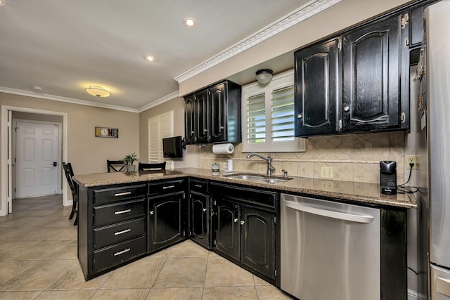 kitchen featuring stainless steel dishwasher, a sink, a peninsula, dark cabinets, and ornamental molding