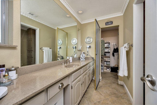 full bathroom featuring tile patterned flooring, vanity, baseboards, visible vents, and ornamental molding