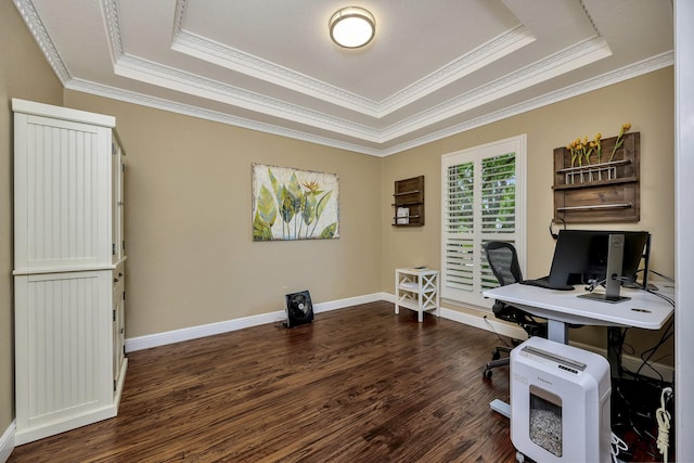 office area featuring dark wood-style flooring, a tray ceiling, and ornamental molding