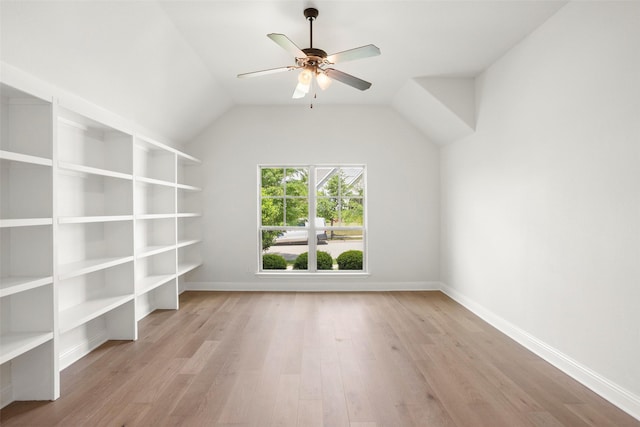 spare room with baseboards, a ceiling fan, and wood finished floors