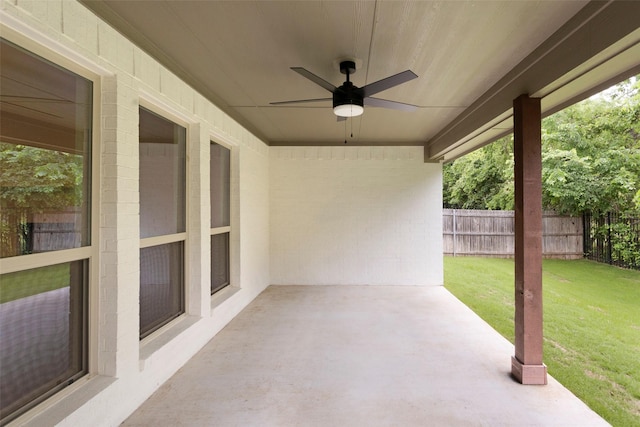 view of patio / terrace with ceiling fan and fence
