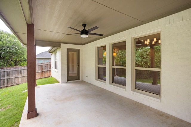 view of patio / terrace with fence and ceiling fan