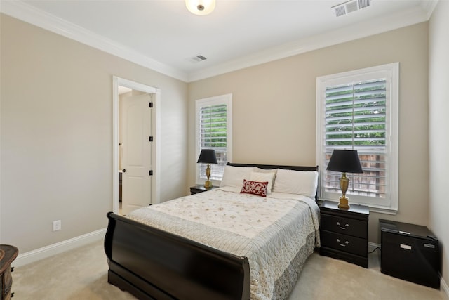 bedroom featuring visible vents, ornamental molding, baseboards, and light colored carpet