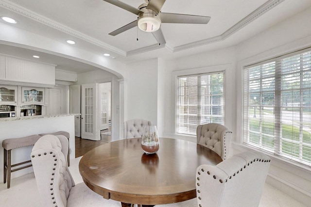 dining space with recessed lighting, arched walkways, ceiling fan, and ornamental molding