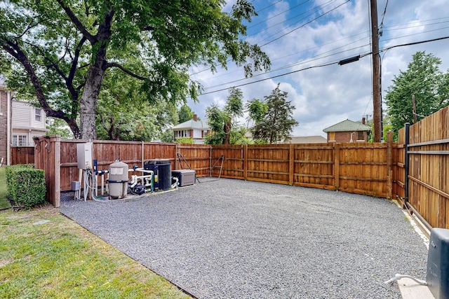 view of yard with a fenced backyard and a patio