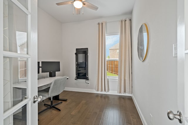 home office featuring baseboards, a ceiling fan, and dark wood-style floors