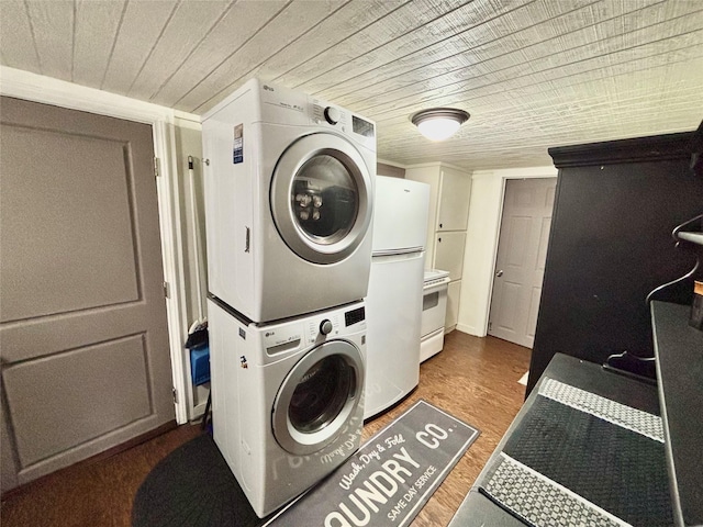 laundry room featuring wood ceiling, wood finished floors, and stacked washer / dryer