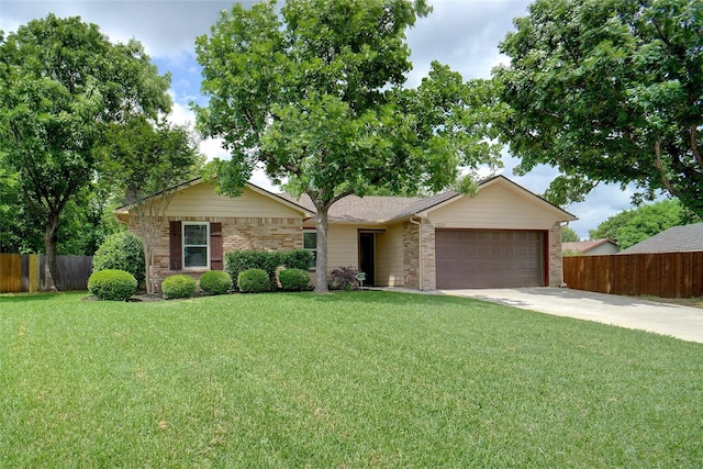 ranch-style house featuring a front lawn, fence, brick siding, concrete driveway, and an attached garage