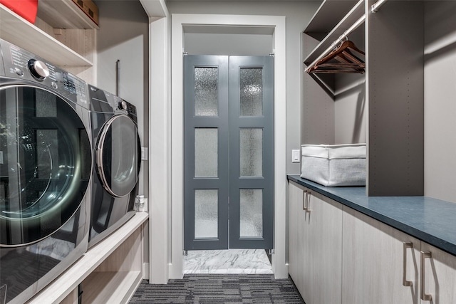 washroom with laundry area and washer and clothes dryer
