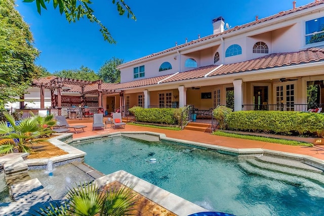2025 Breaker Ln, Flower Mound, TX 75022 - rear view of house featuring a tiled roof, ceiling fan, a chimney, an outdoor pool, and a pergola