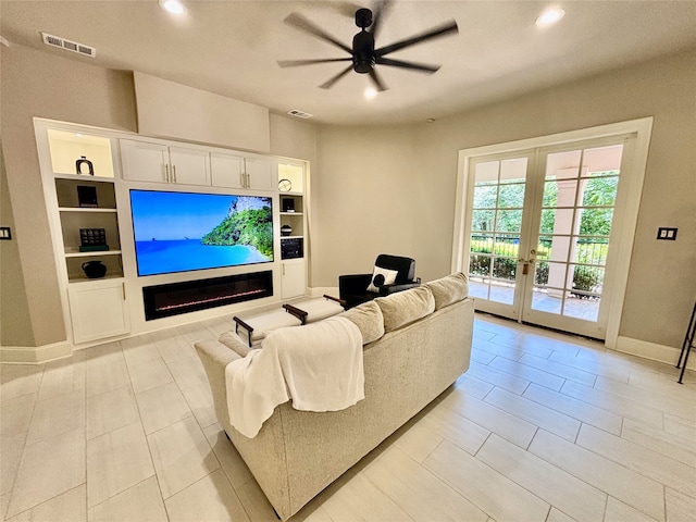 2025 Breaker Ln, Flower Mound, TX 75022 - living room with a ceiling fan, baseboards, visible vents, and french doors