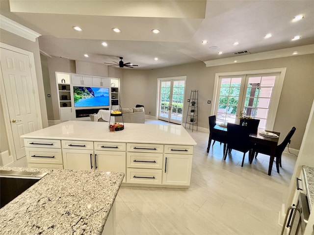 2025 Breaker Ln, Flower Mound, TX 75022 - kitchen featuring ceiling fan, light stone countertops, white cabinetry, recessed lighting, and visible vents