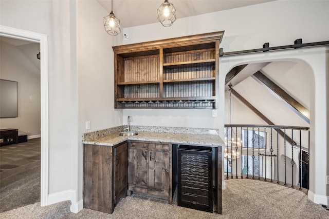 6380 Forefront Ave, Frisco, TX 75036 - indoor wet bar featuring carpet flooring, wine cooler, baseboards, pendant lighting, and a barn door