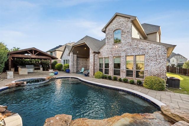 6380 Forefront Ave, Frisco, TX 75036 - view of pool featuring an outdoor kitchen, a gazebo, a patio area, and a pool with connected hot tub