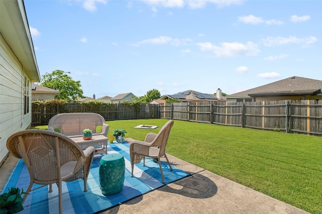 view of patio with an outdoor living space and a fenced backyard