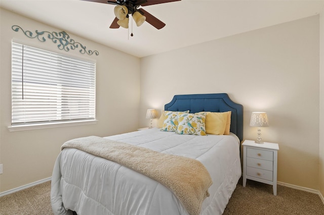 carpeted bedroom with baseboards and ceiling fan