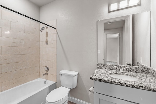2021 Eva St, Grand Prairie, TX 75051 - full bathroom featuring toilet, baseboards, shower / bathing tub combination, and vanity