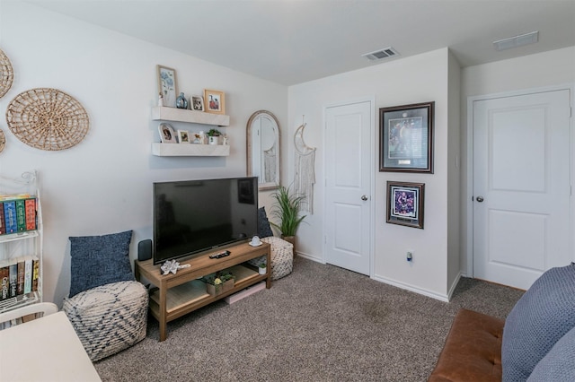 living room with baseboards, carpet flooring, and visible vents