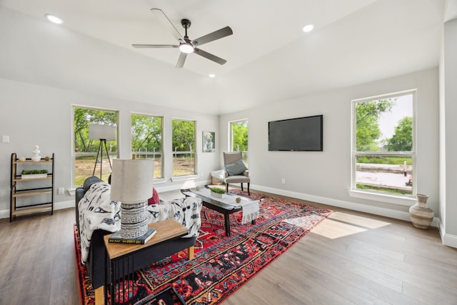 living room featuring baseboards, a ceiling fan, wood finished floors, and recessed lighting