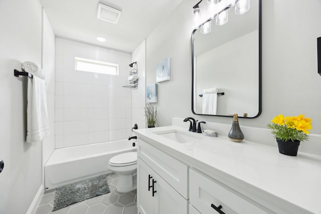 bathroom with visible vents, tile patterned flooring, vanity, baseboards, and toilet
